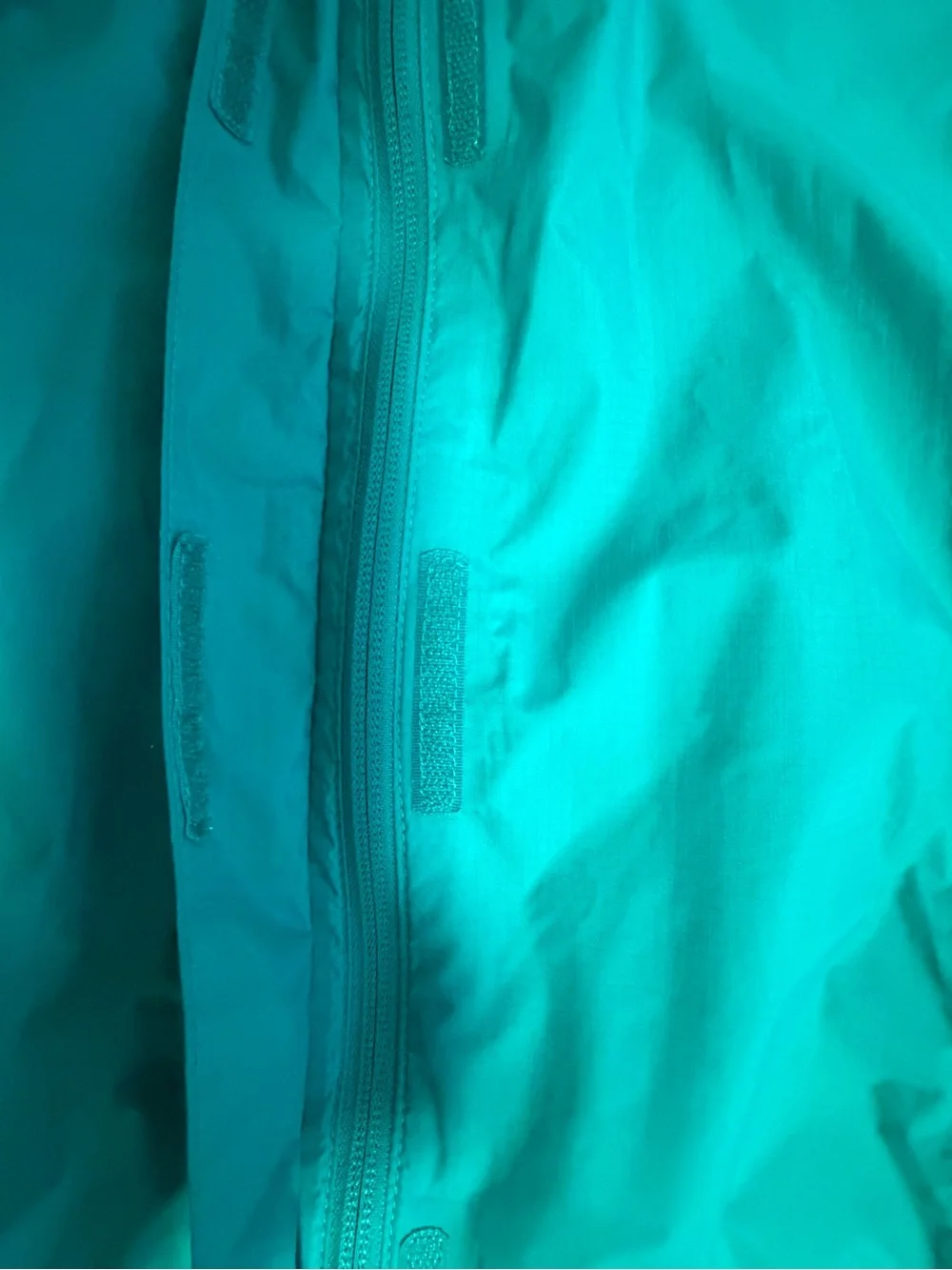 The North Face Turquoise Rain Shell with Pink Trim
